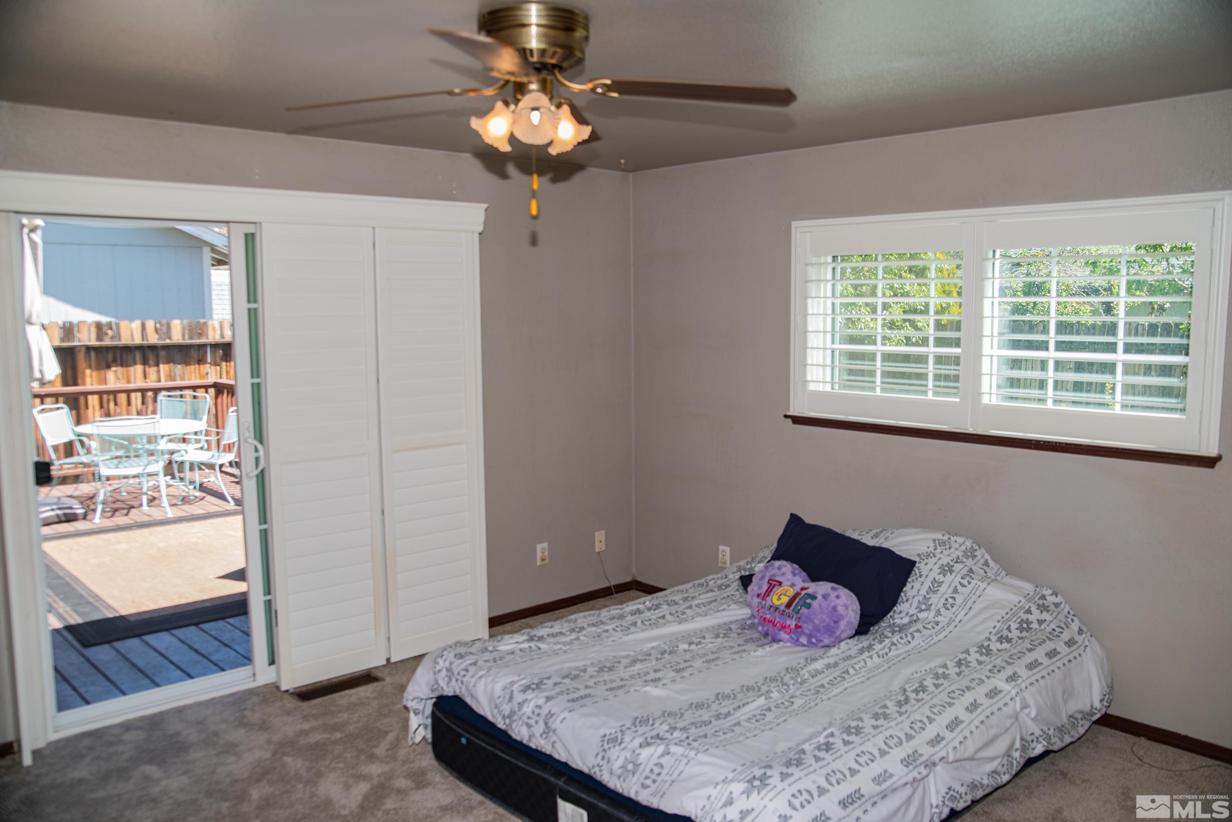 2525 Ridgecrest Drive Carson City, NV 89706 - Photo 9 of 21 a bedroom with a bed dresser and a window