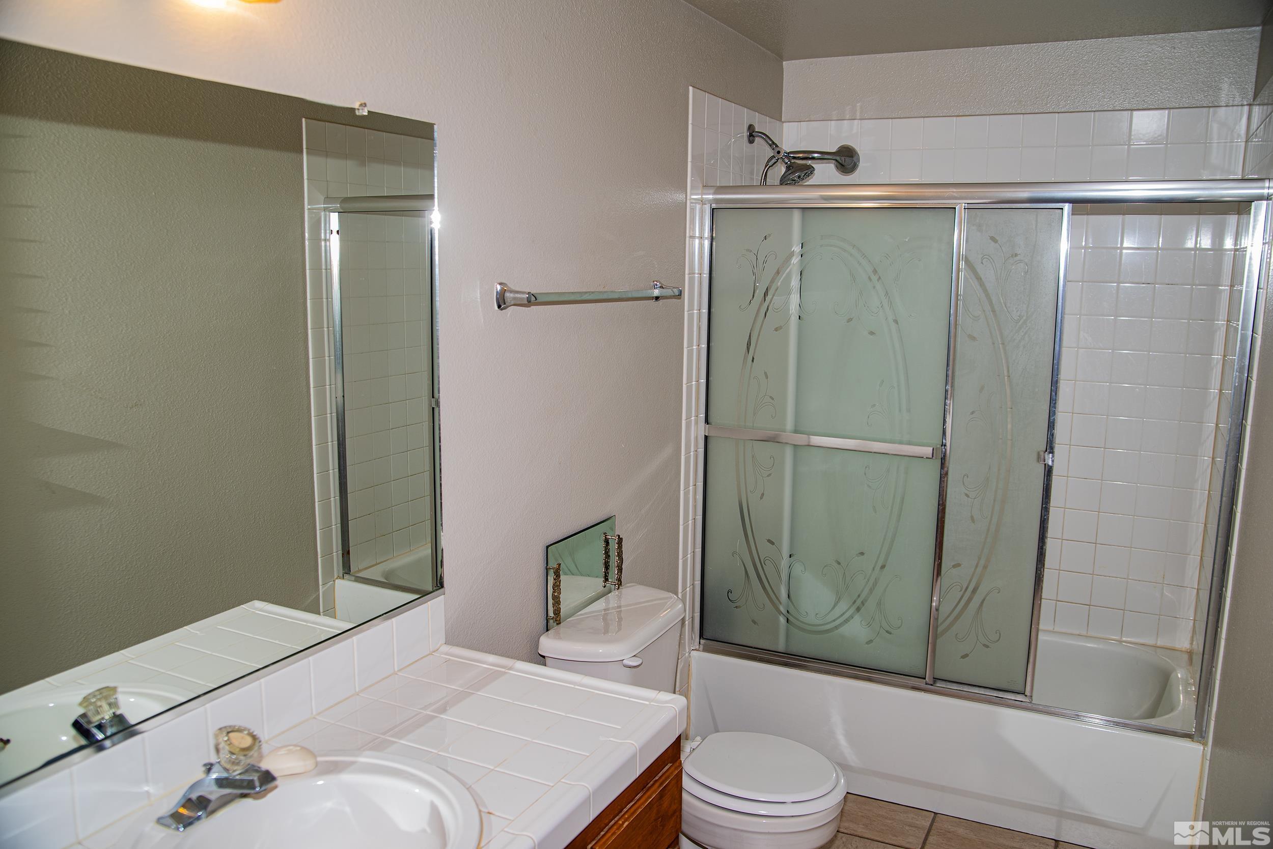 2525 Ridgecrest Drive Carson City, NV 89706 - Photo 10 of 21 a bathroom with a sink and toilet