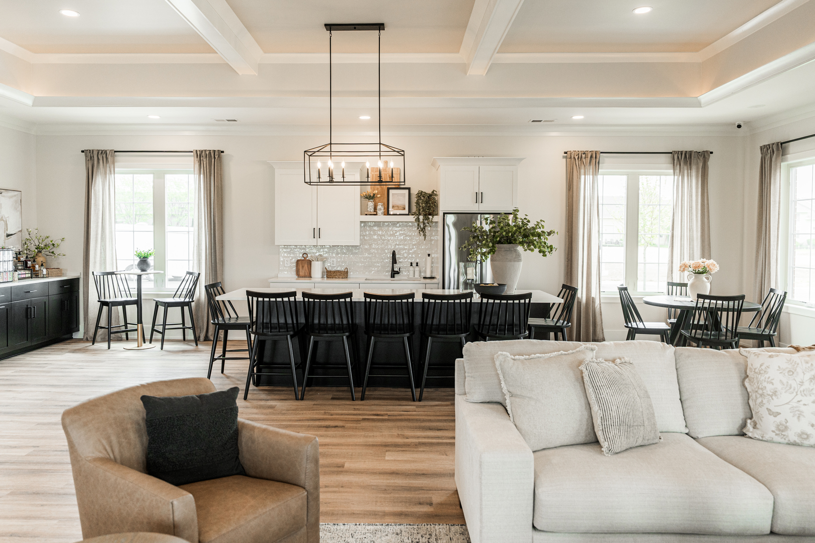 64 Kloe Lane, Unit 64 Sycamore, IL 60178 - Photo 24 of 45 a living room with furniture kitchen view and a chandelier