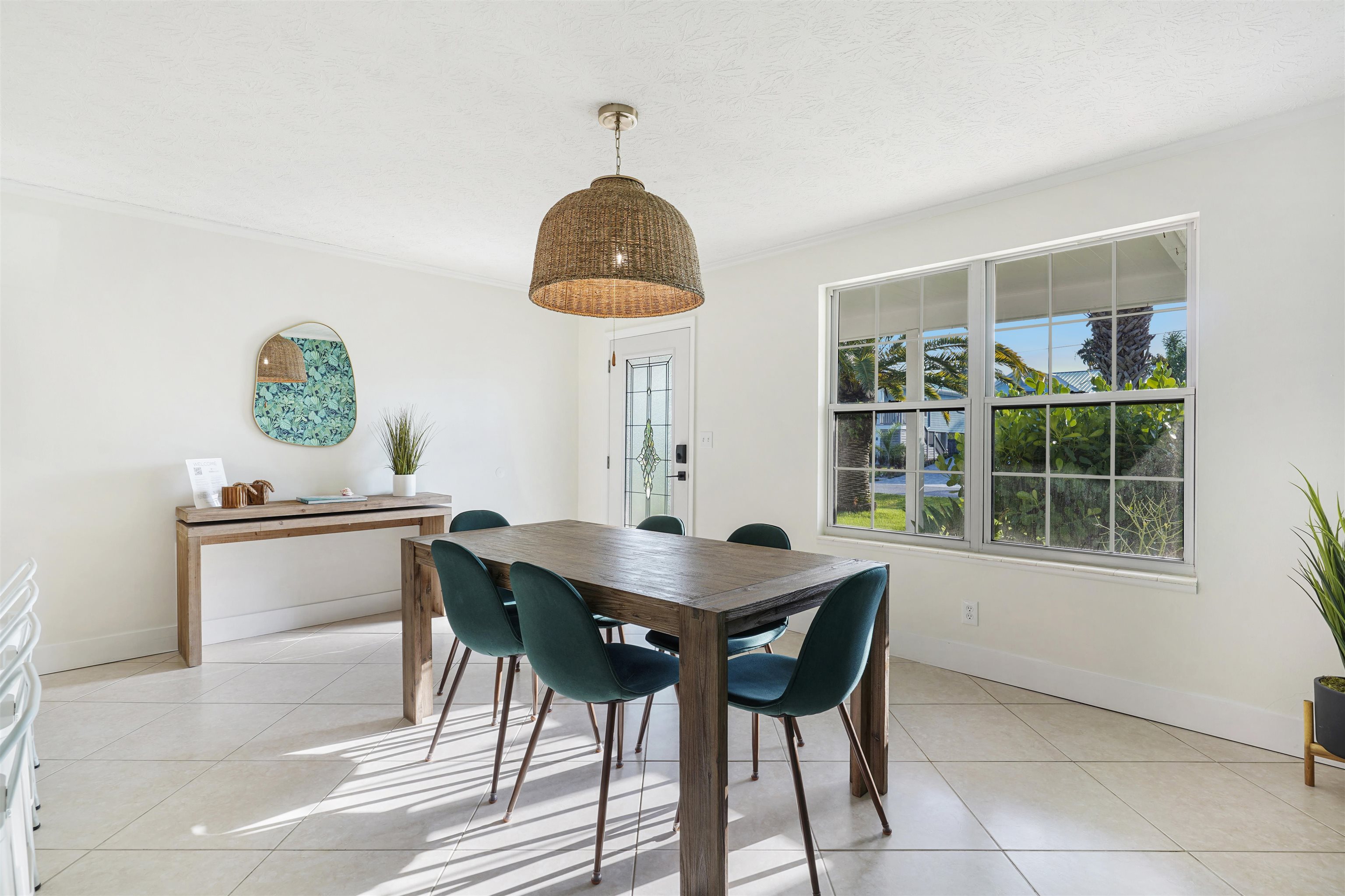 5436 4th Street St. Augustine, FL 32080 - Photo 16 of 45 a view of a dining room with furniture and chandelier