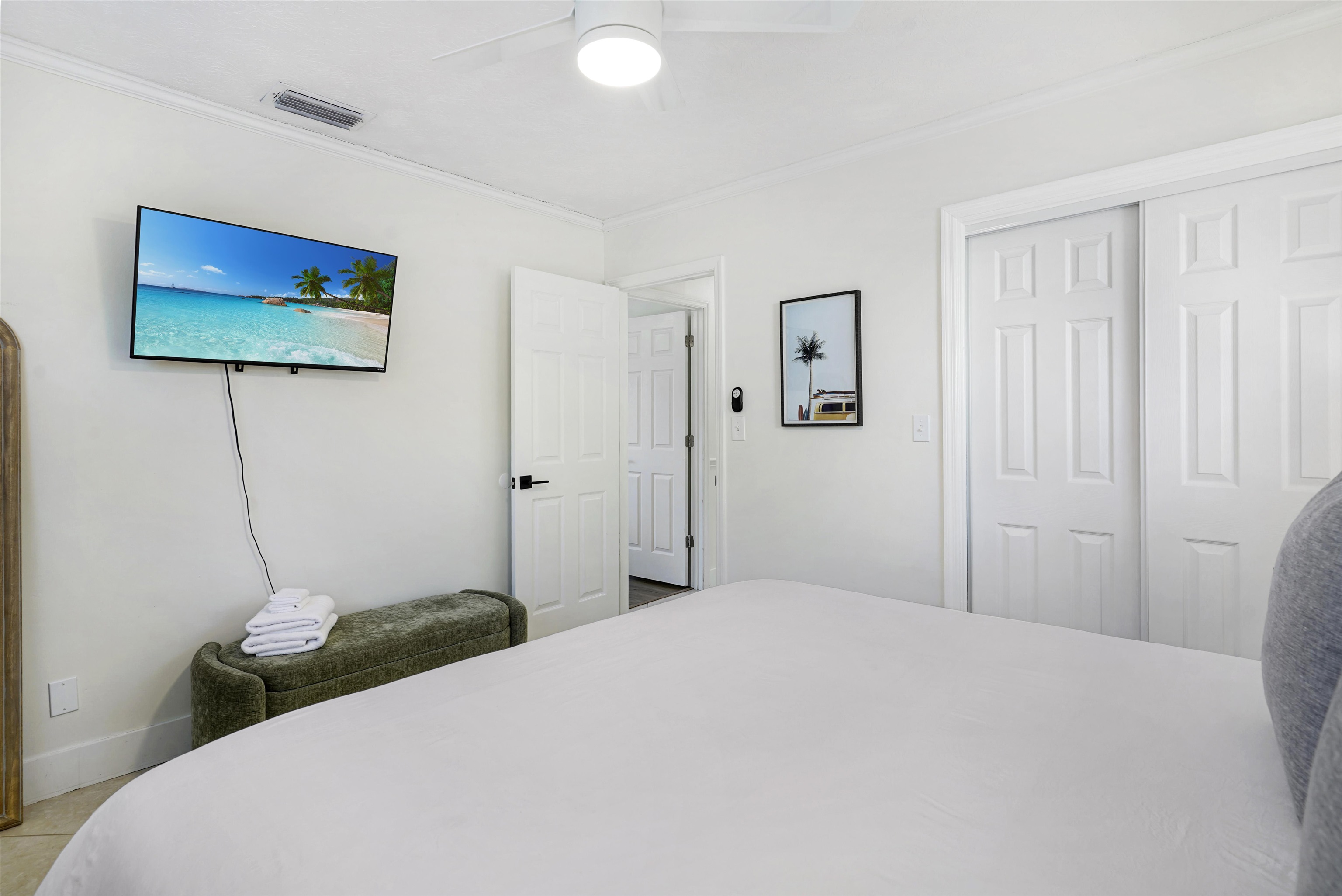 5436 4th Street St. Augustine, FL 32080 - Photo 24 of 45 a bedroom with a bed and a wall painting