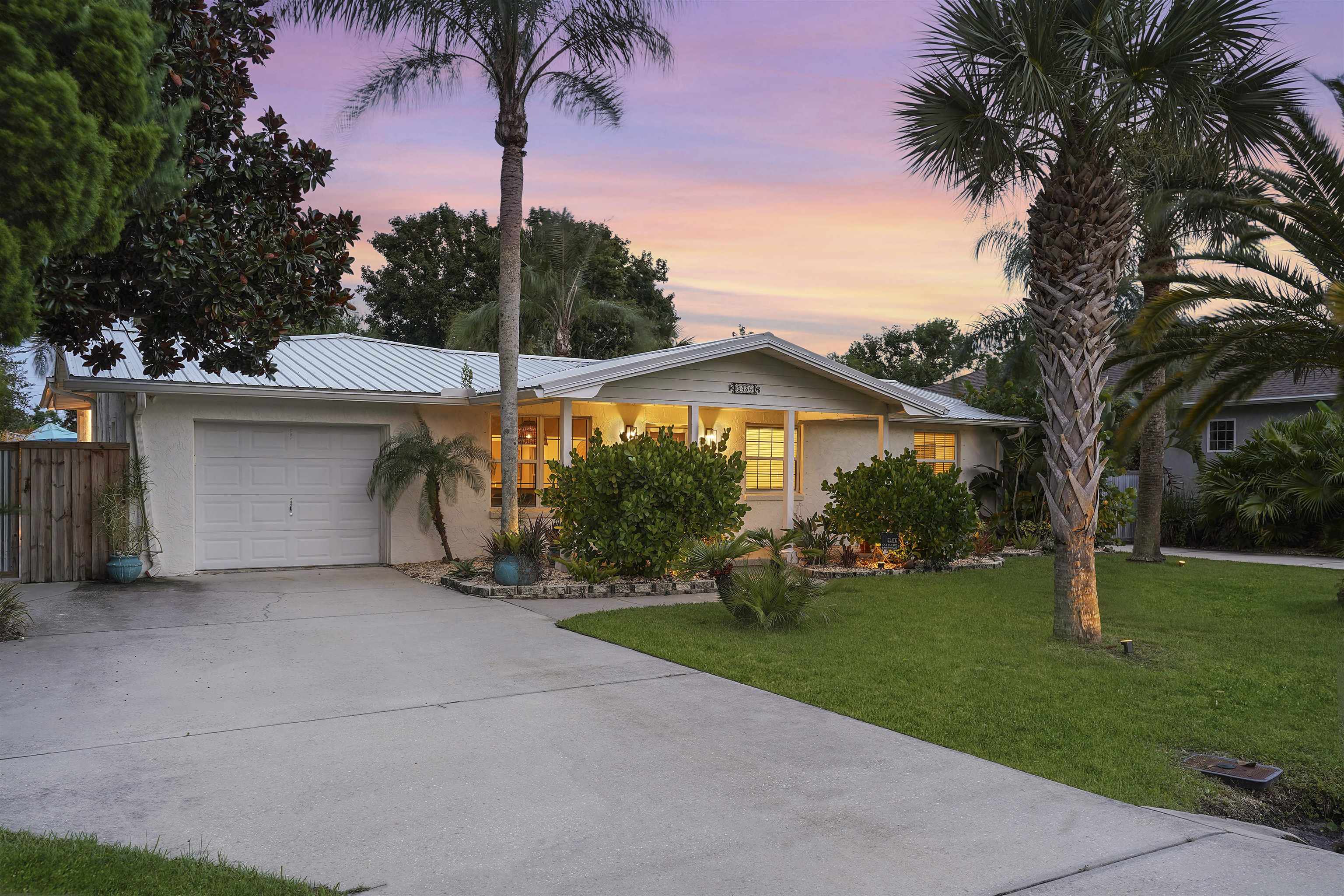 5436 4th Street St. Augustine, FL 32080 - Photo 7 of 45 a view of a house with a yard and palm trees