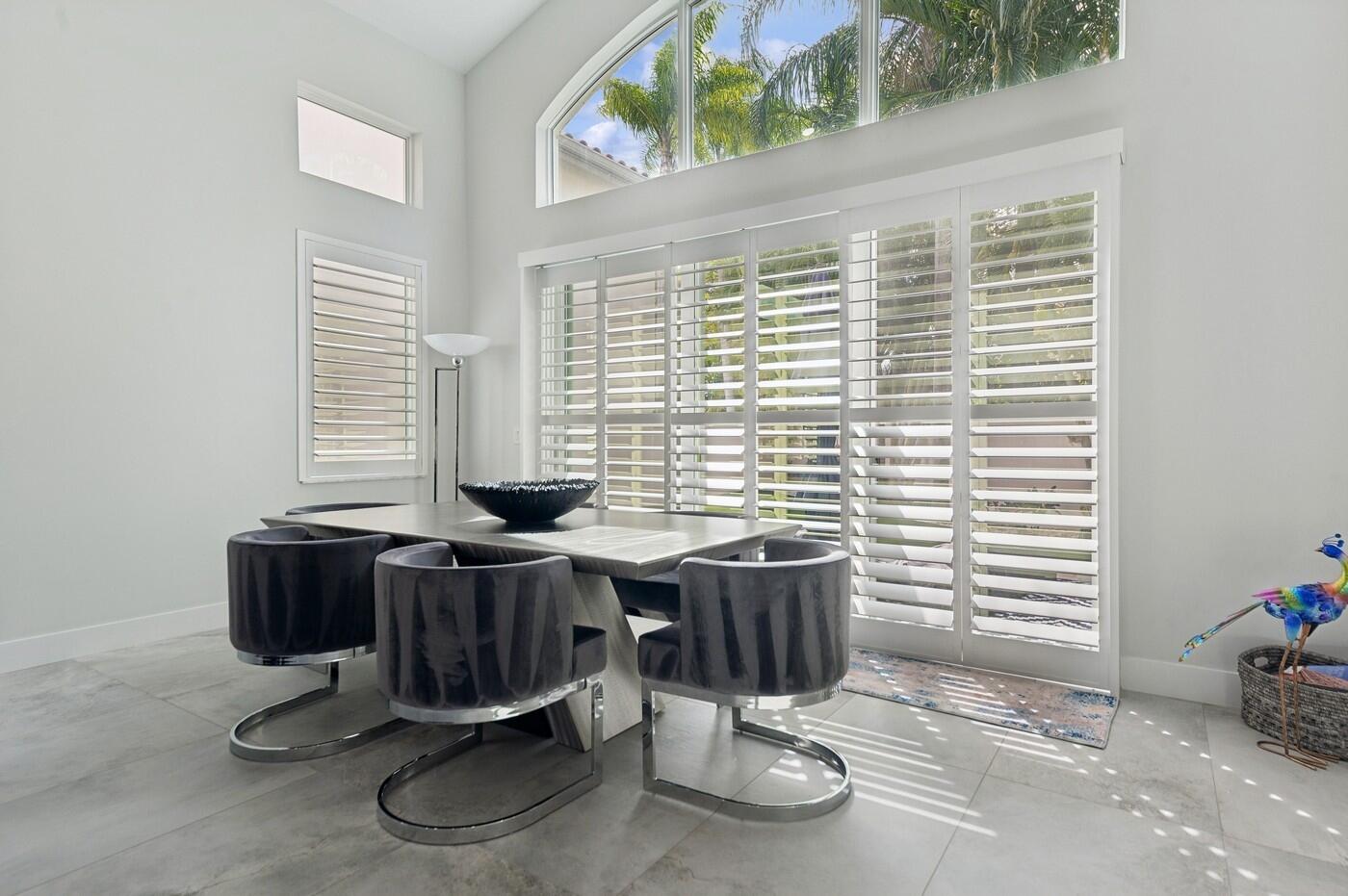 2558 Northwest 52nd Street Boca Raton, FL 33496 - Photo 13 of 27 a view of a room with a table and chairs