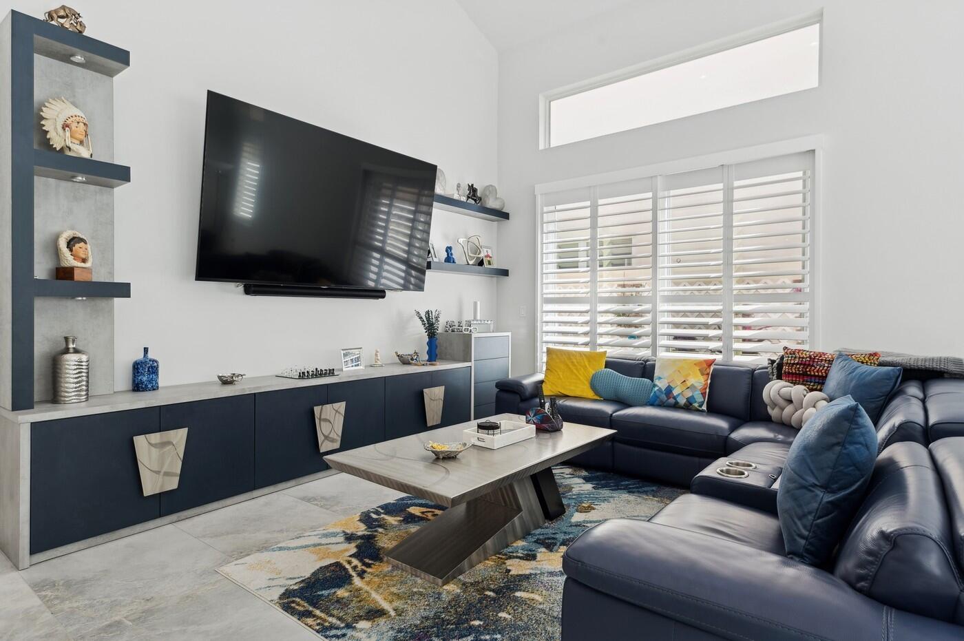 2558 Northwest 52nd Street Boca Raton, FL 33496 - Photo 5 of 27 a living room with furniture and a flat screen tv