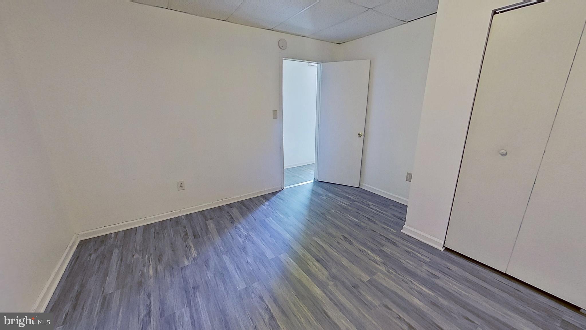 648 Broadway, Unit A Hanover, PA 17331 - Photo 7 of 10 a view of an empty room with wooden floor