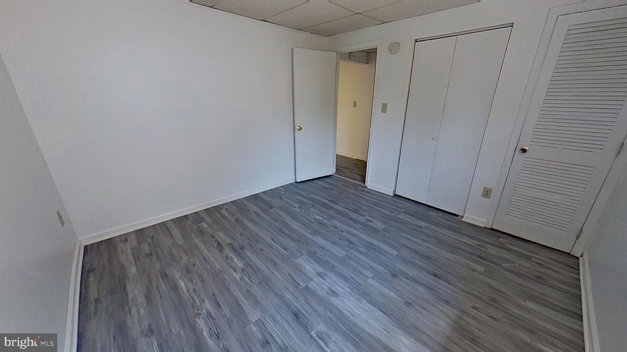 648 Broadway, Unit A Hanover, PA 17331 - Photo 9 of 10 a view of an empty room with wooden floor