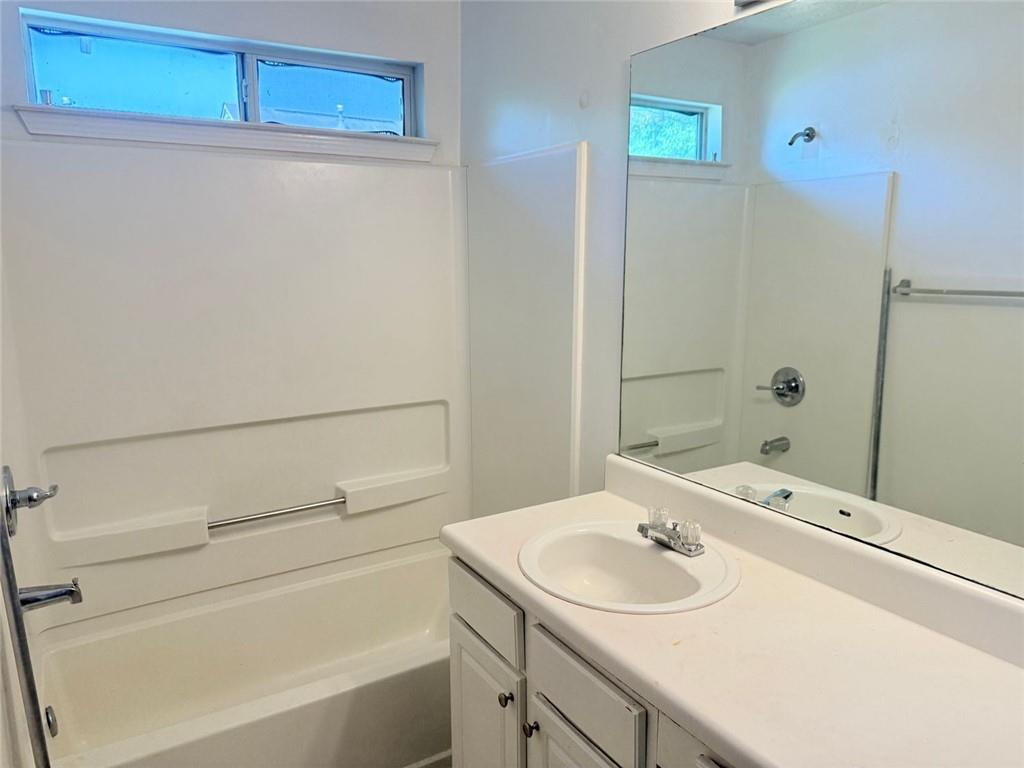 2502 Walden Lake Drive Decatur, GA 30035 - Photo 4 of 8 a bathroom with a sink and a bathtub