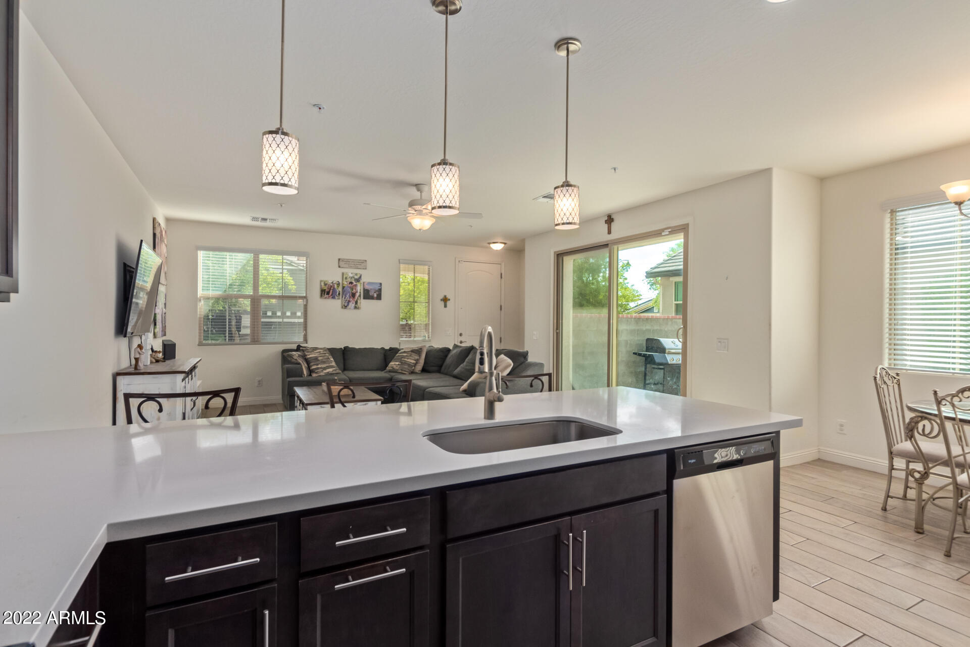 2345 North Alsap Road Buckeye, AZ 85396 - Photo 13 of 50 a kitchen with a sink a counter space appliances and cabinets