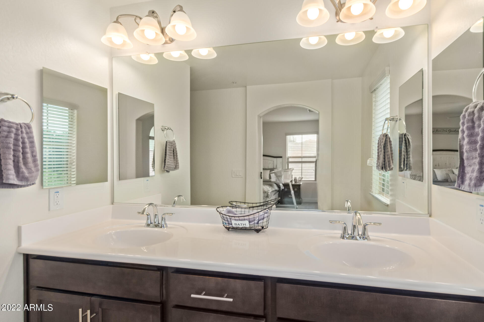 2345 North Alsap Road Buckeye, AZ 85396 - Photo 22 of 50 a bathroom with a sink a light fixture and a mirror