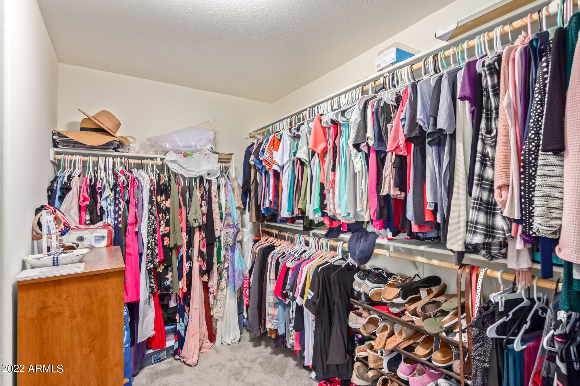 2345 North Alsap Road Buckeye, AZ 85396 - Photo 23 of 50 a view of walk in closet with clothes