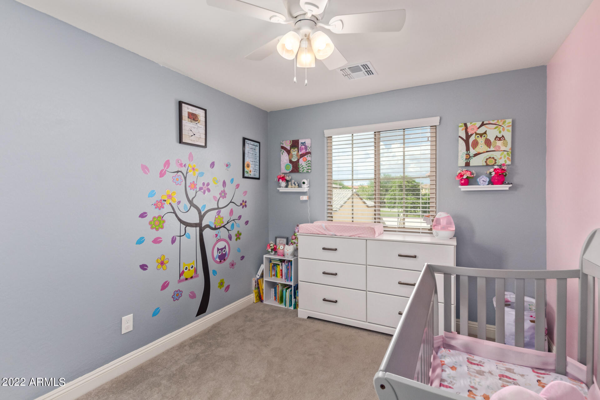 2345 North Alsap Road Buckeye, AZ 85396 - Photo 24 of 50 a bedroom with a bed and a window