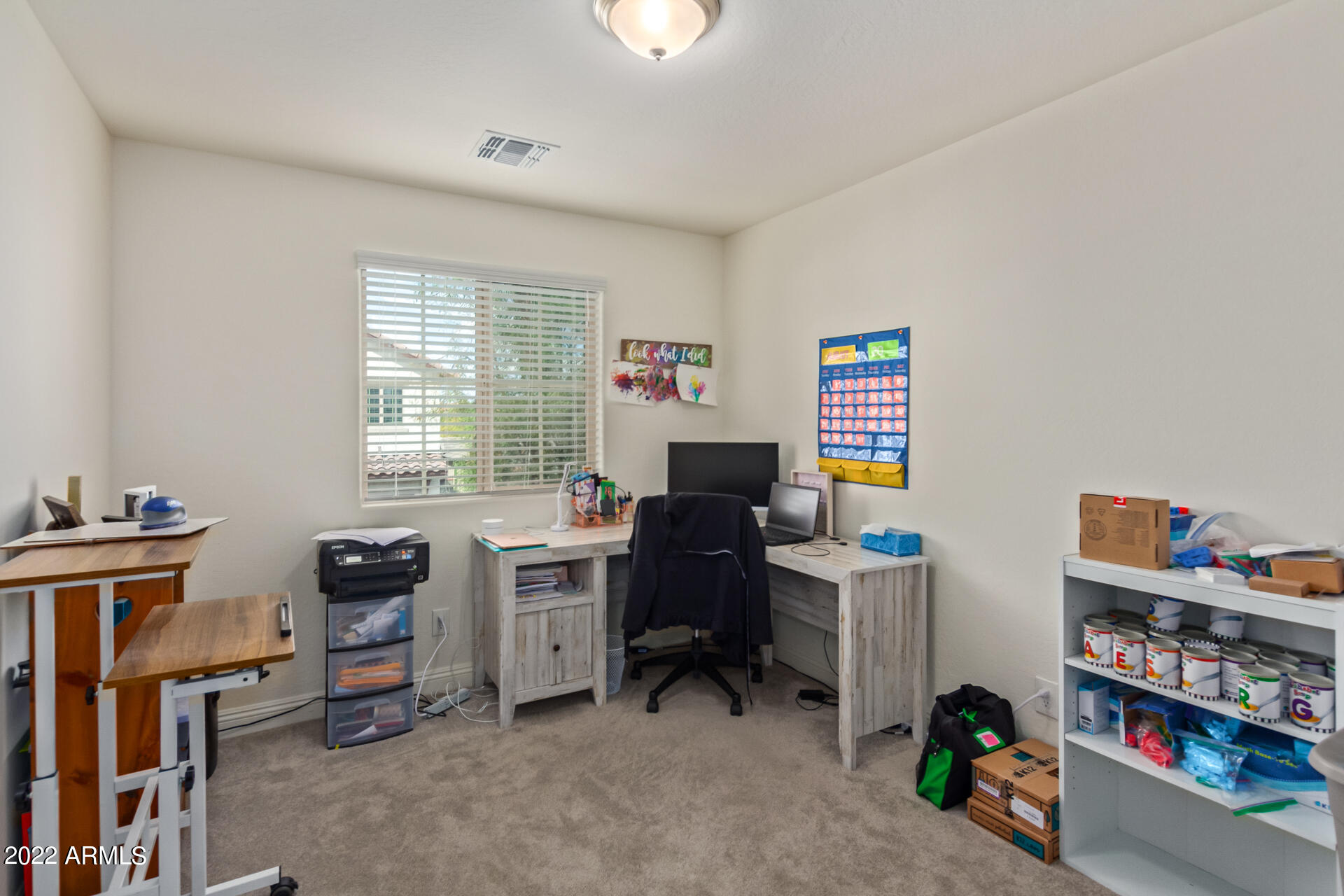 2345 North Alsap Road Buckeye, AZ 85396 - Photo 25 of 50 a view of a workspace with furniture and a window