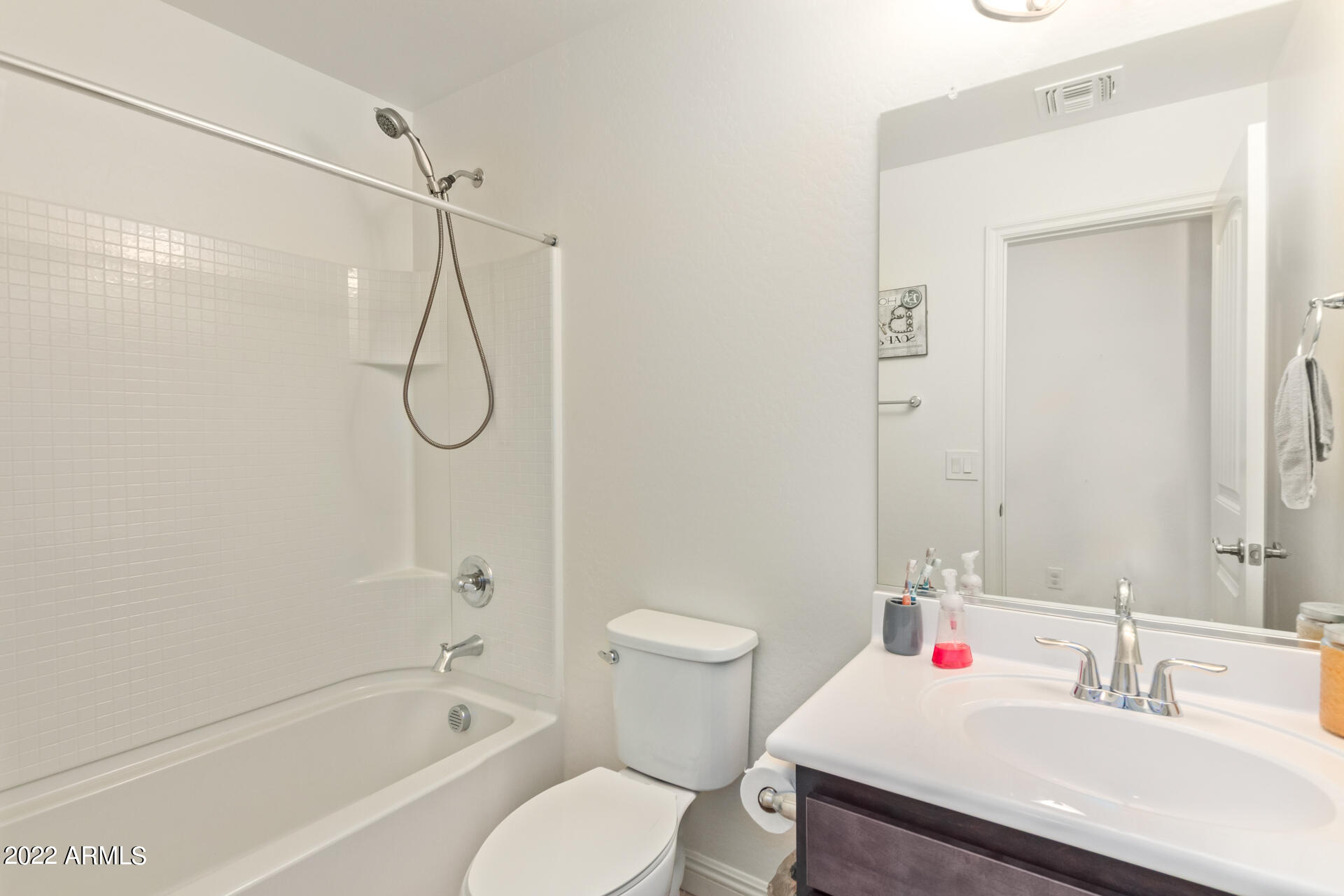 2345 North Alsap Road Buckeye, AZ 85396 - Photo 28 of 50 a bathroom with a sink toilet and shower