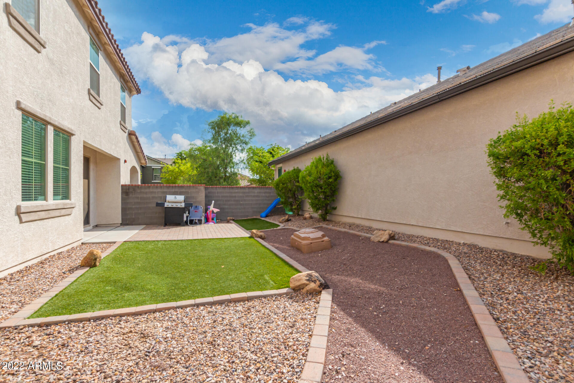 2345 North Alsap Road Buckeye, AZ 85396 - Photo 32 of 50 a front view of a house with garden