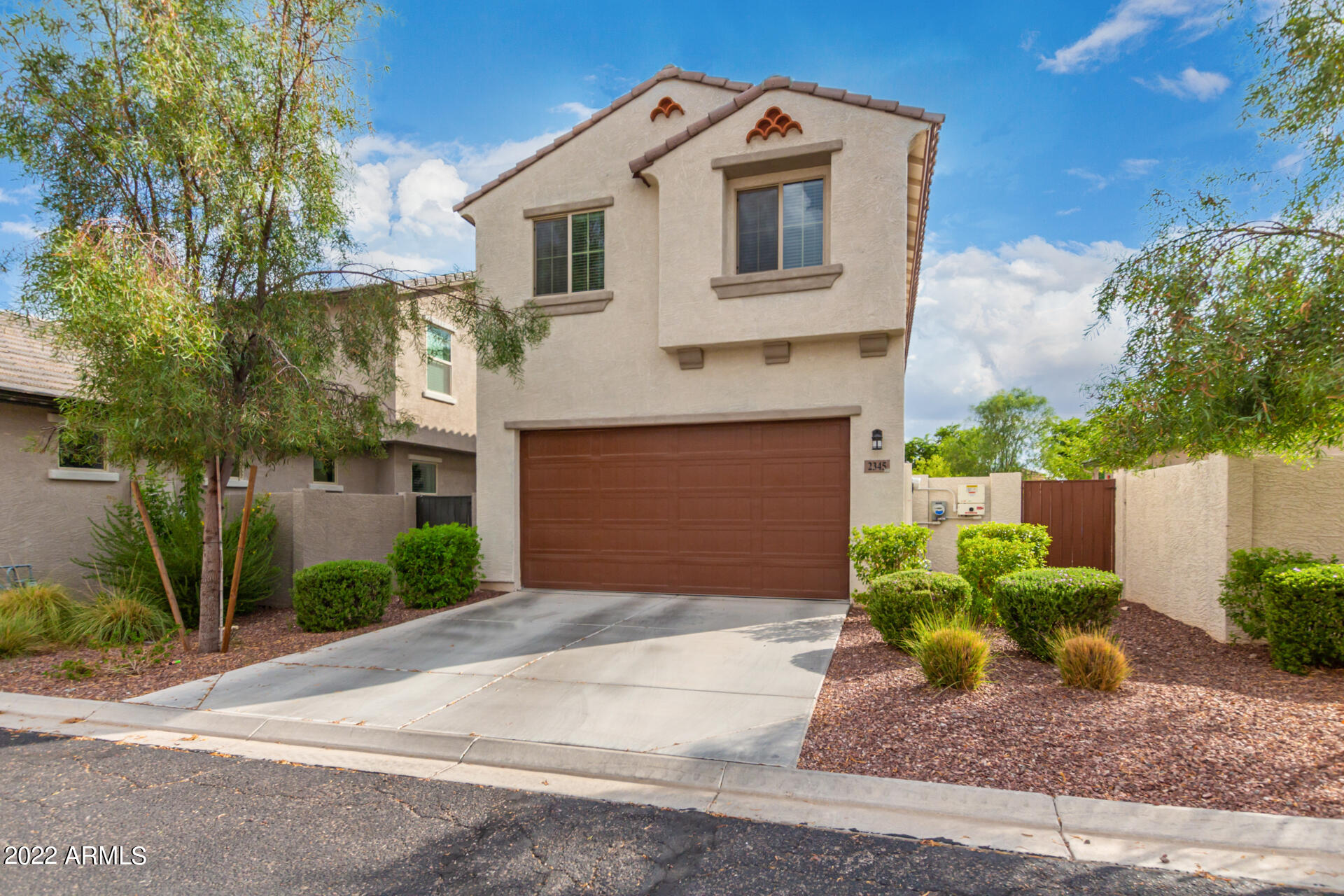 2345 North Alsap Road Buckeye, AZ 85396 - Photo 34 of 50 a front view of a house with garden