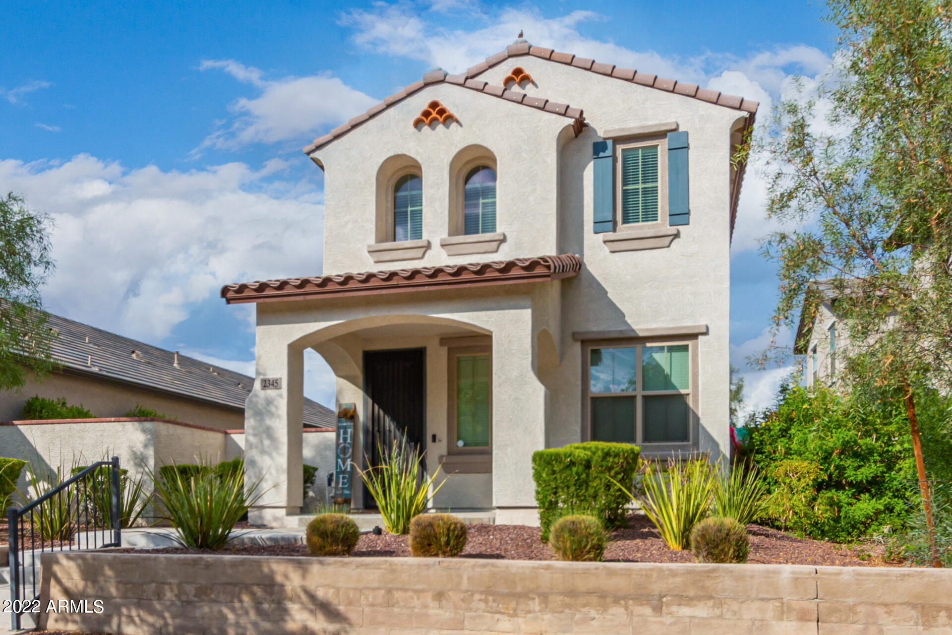 2345 North Alsap Road Buckeye, AZ 85396 - Photo 6 of 50 a front view of a house with garden