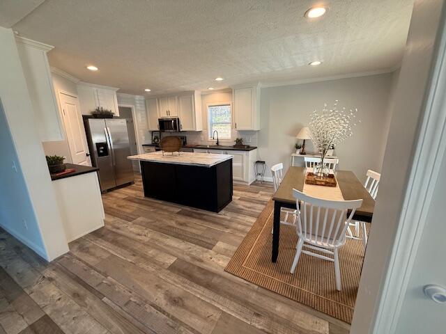 2475 Coles Creek Road Rocky Mount, VA 24151 - Photo 13 of 42 a living room with furniture a flat screen tv and kitchen view