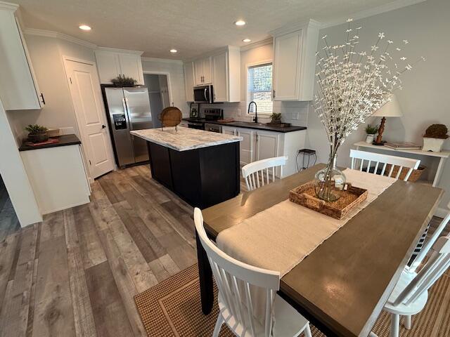 2475 Coles Creek Road Rocky Mount, VA 24151 - Photo 17 of 42 a kitchen with a table chairs a sink and a refrigerator