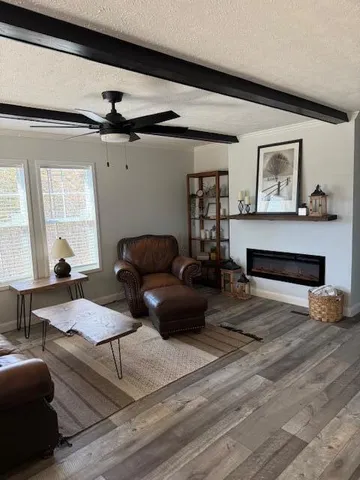 a living room with furniture and a window