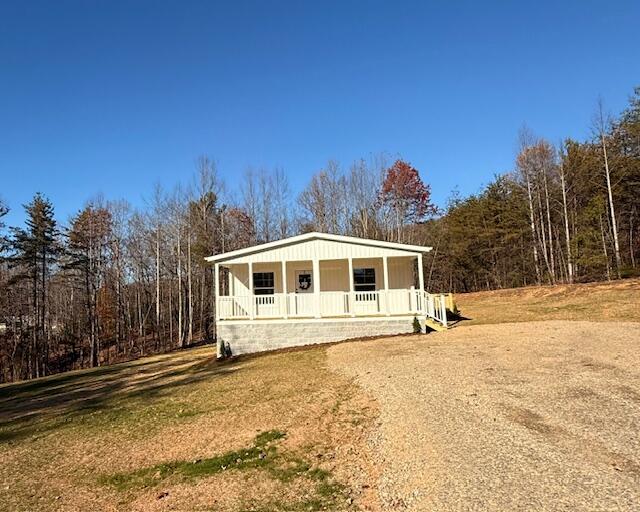 2475 Coles Creek Road Rocky Mount, VA 24151 - Photo 35 of 42 a house with trees in the background