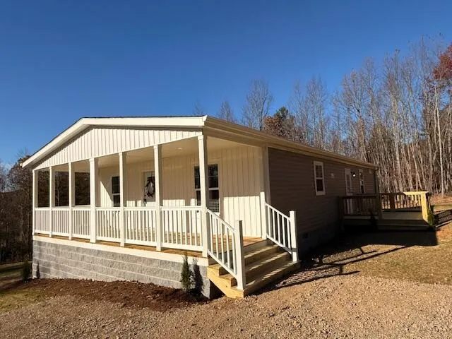 a front view of a house with a fence
