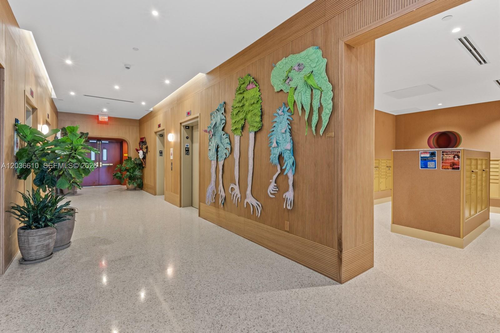 90 Northeast 32nd Street, Unit 1014 Miami, FL 33127 - Photo 32 of 39 a view of a hallway with painted walls