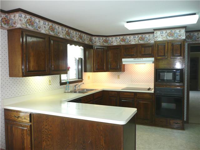 2720 Academy Road Lebanon, TN 37087 - Photo 12 of 16 a kitchen with a sink and a refrigerator