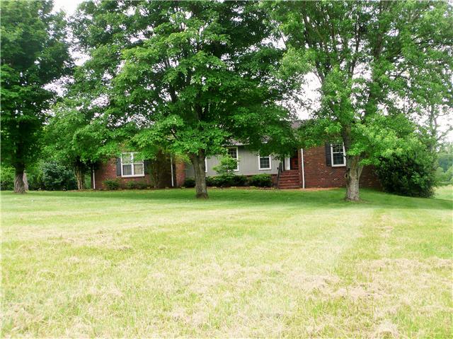 2720 Academy Road Lebanon, TN 37087 - Photo 2 of 16 a front view of a house with a garden