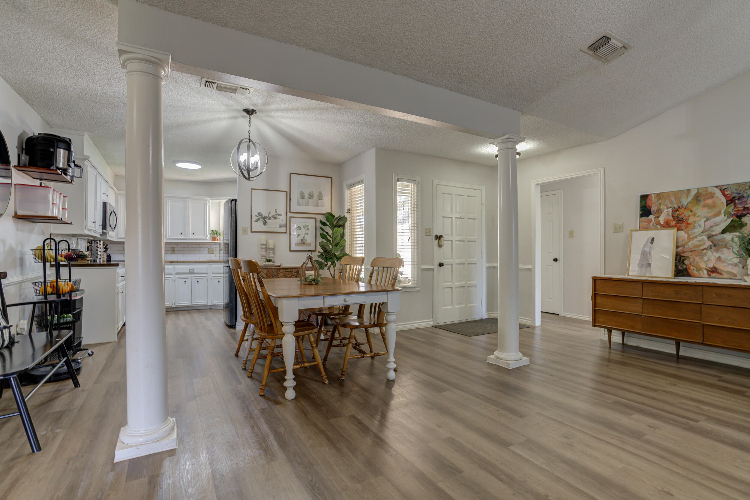 3712 103rd Street Lubbock, TX 79423 - Photo 11 of 43 a dining room with furniture and wooden floor