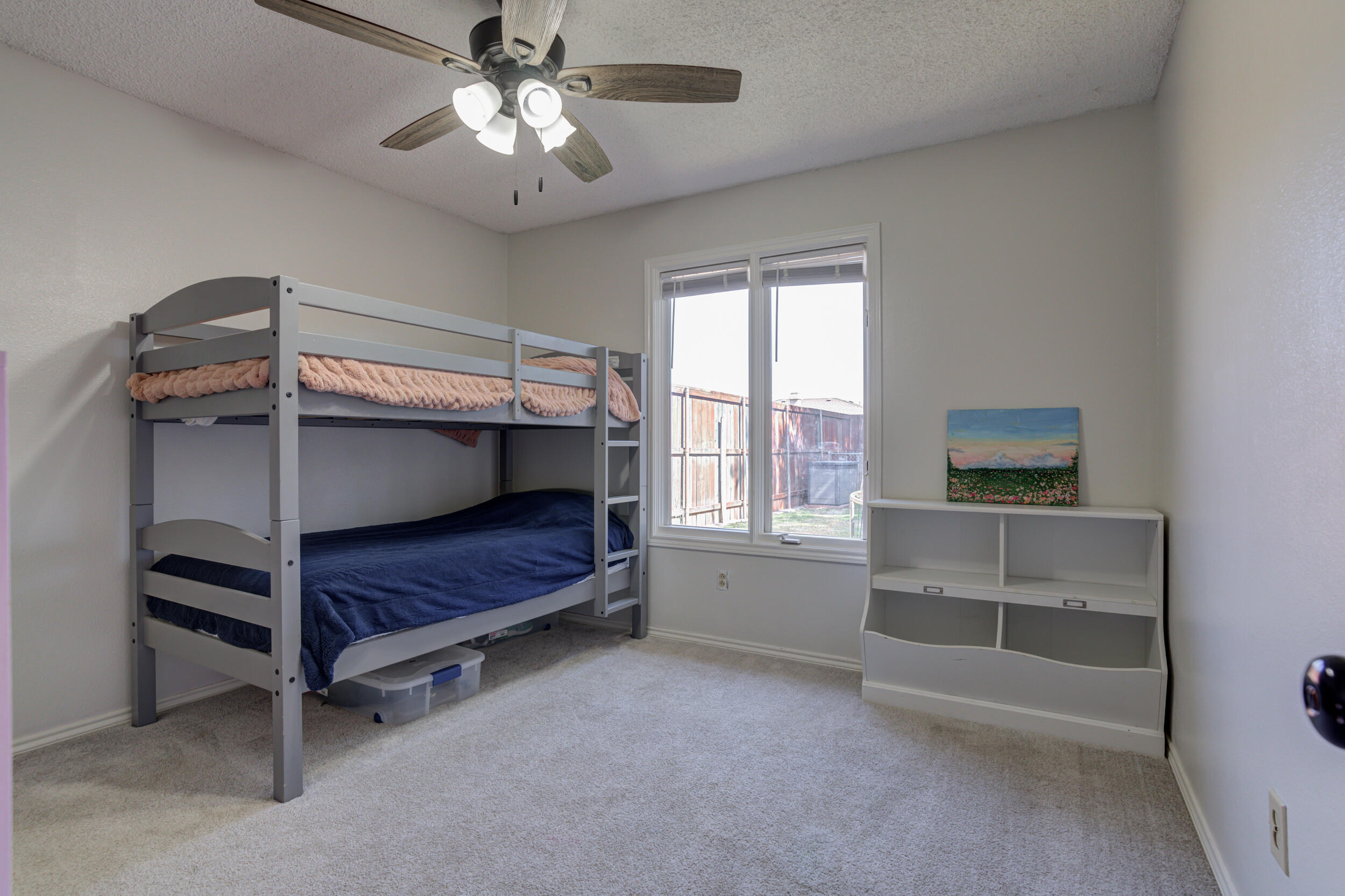 3712 103rd Street Lubbock, TX 79423 - Photo 23 of 43 a bedroom with furniture and window