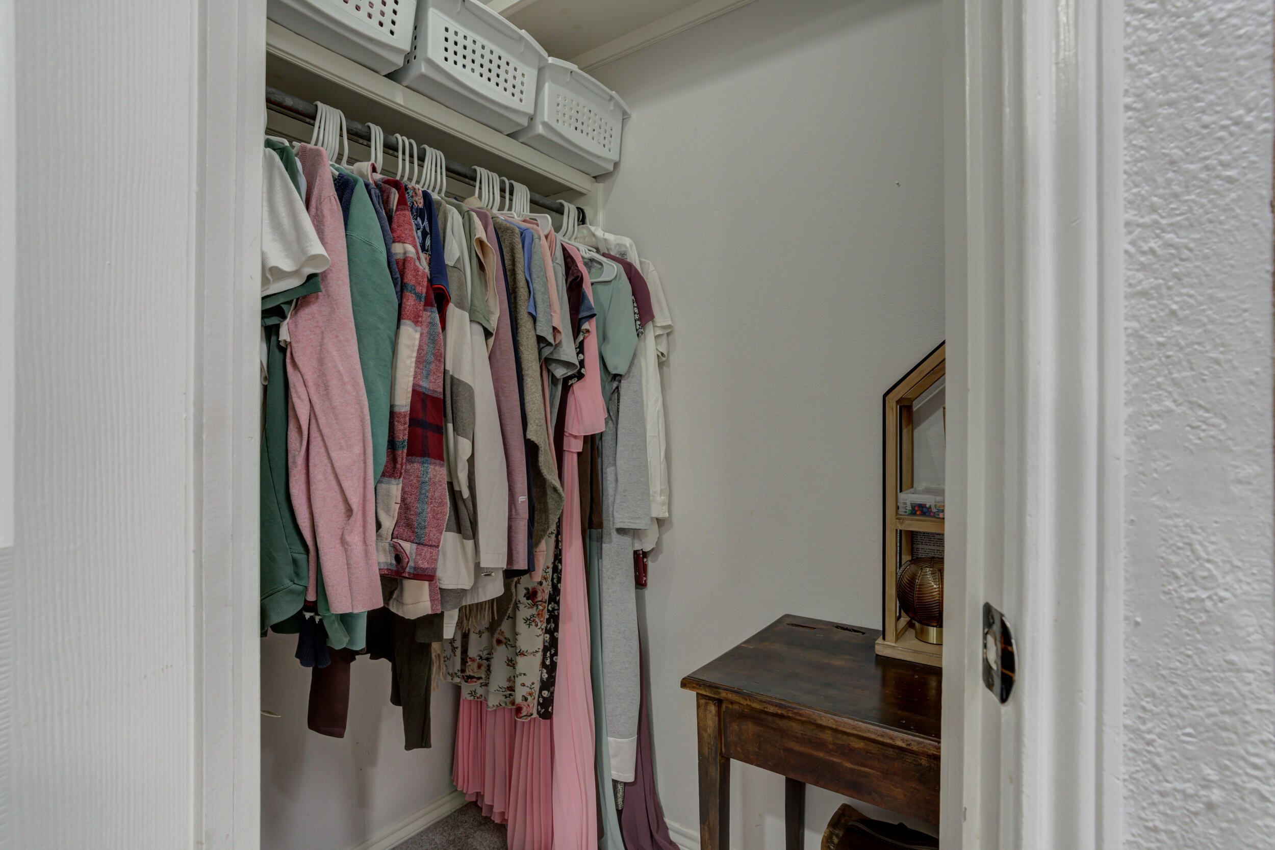 3712 103rd Street Lubbock, TX 79423 - Photo 36 of 43 a view of walk in closet with clothes and shoes