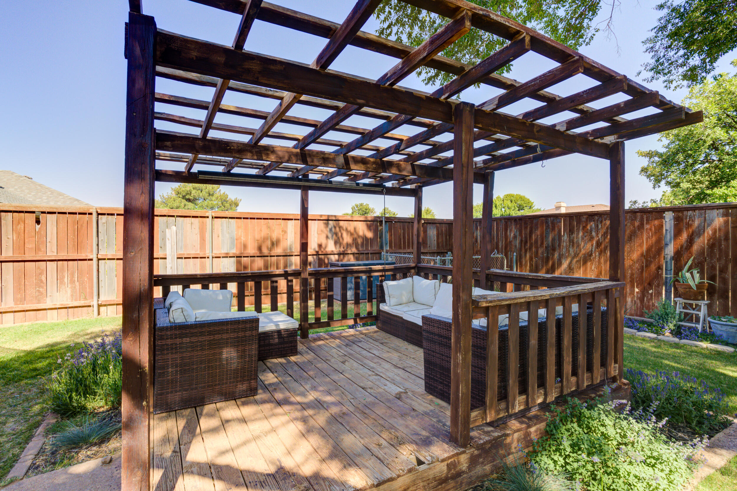3712 103rd Street Lubbock, TX 79423 - Photo 40 of 43 a view of a roof deck with wooden fence