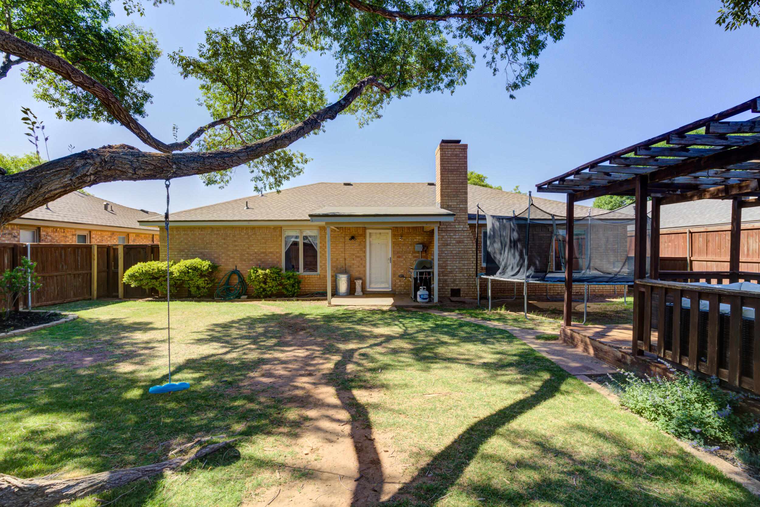 3712 103rd Street Lubbock, TX 79423 - Photo 41 of 43 a view of a house with backyard and sitting area