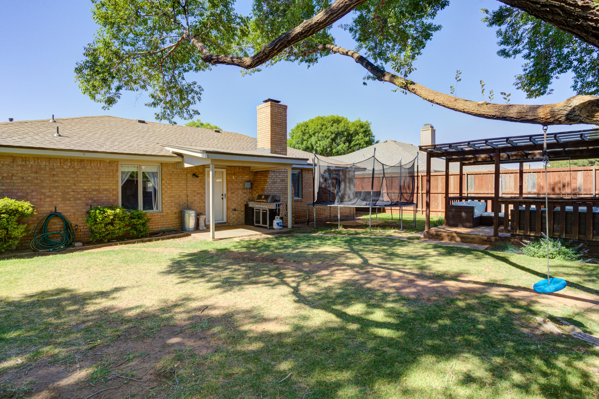 3712 103rd Street Lubbock, TX 79423 - Photo 42 of 43 a view of a house with backyard and sitting area