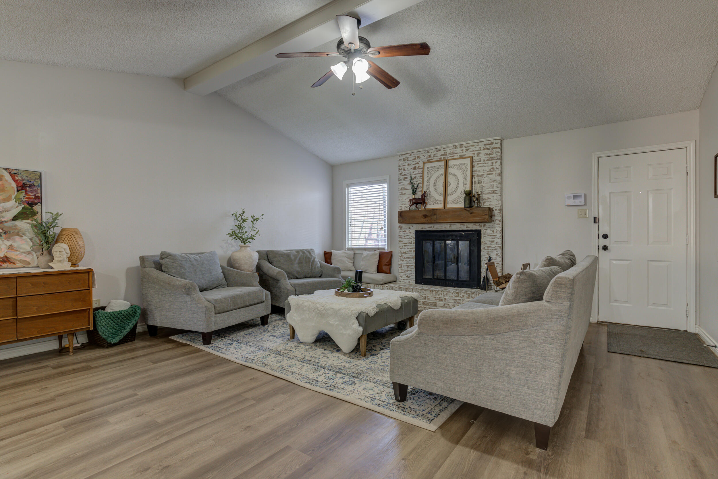 3712 103rd Street Lubbock, TX 79423 - Photo 7 of 43 a living room with furniture fireplace and flat screen tv