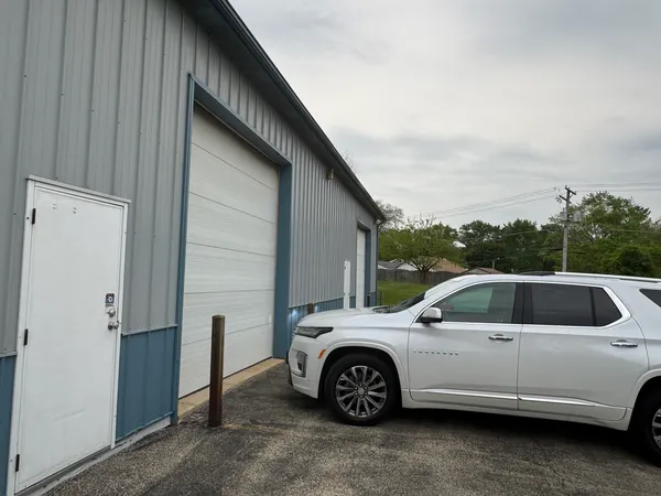 a view of a car that is parked in a parking lot
