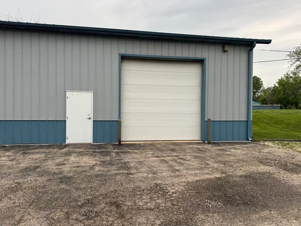 a view of backyard with garage
