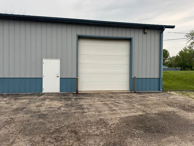 a view of backyard with garage