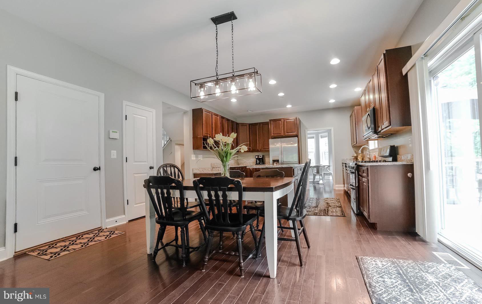 2160 Lowery Road Huntingtown, MD 20639 - Photo 15 of 53 a view of a dining room with furniture window and wooden floor
