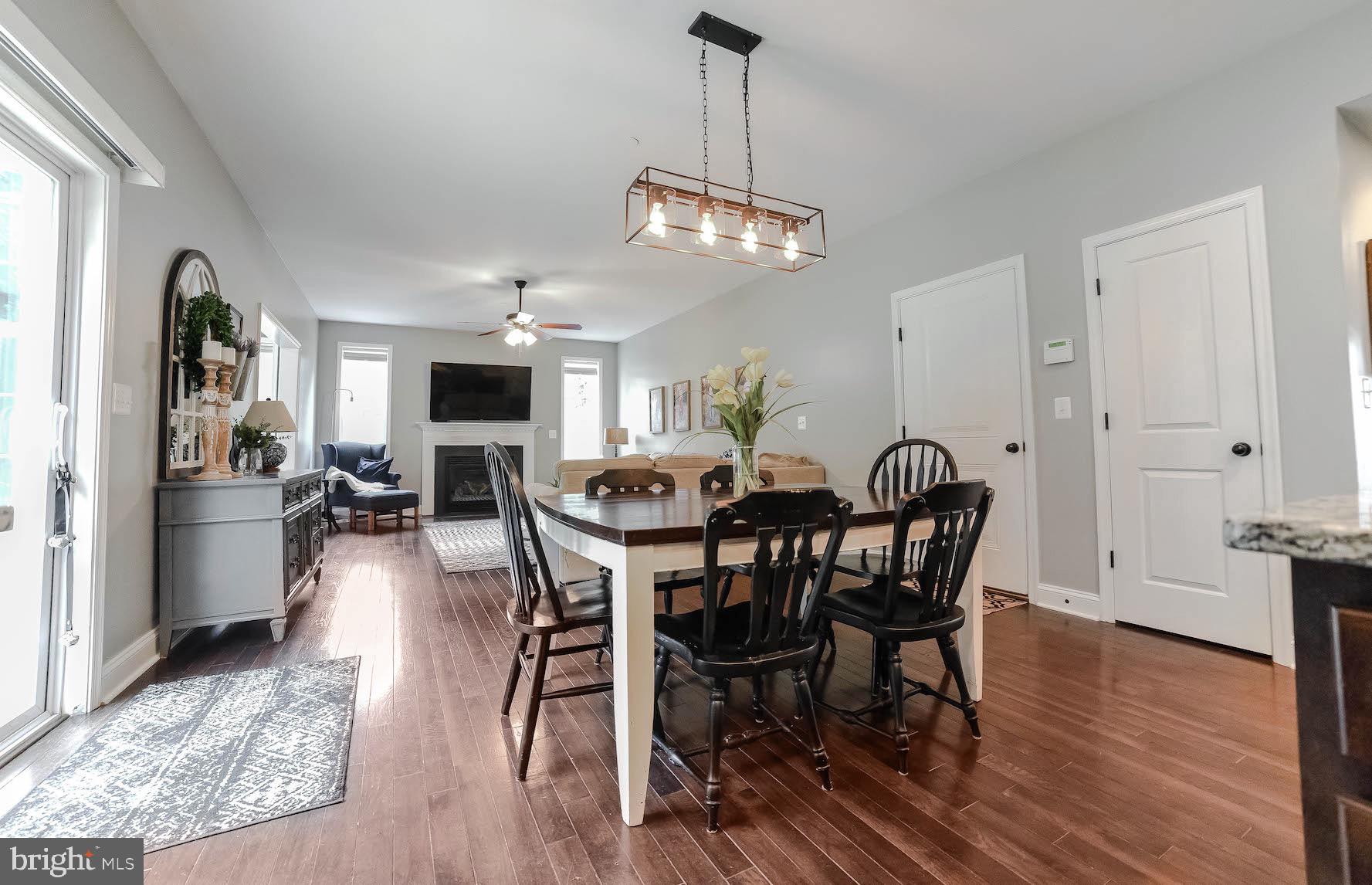 2160 Lowery Road Huntingtown, MD 20639 - Photo 16 of 53 a view of a dining room with furniture window and wooden floor