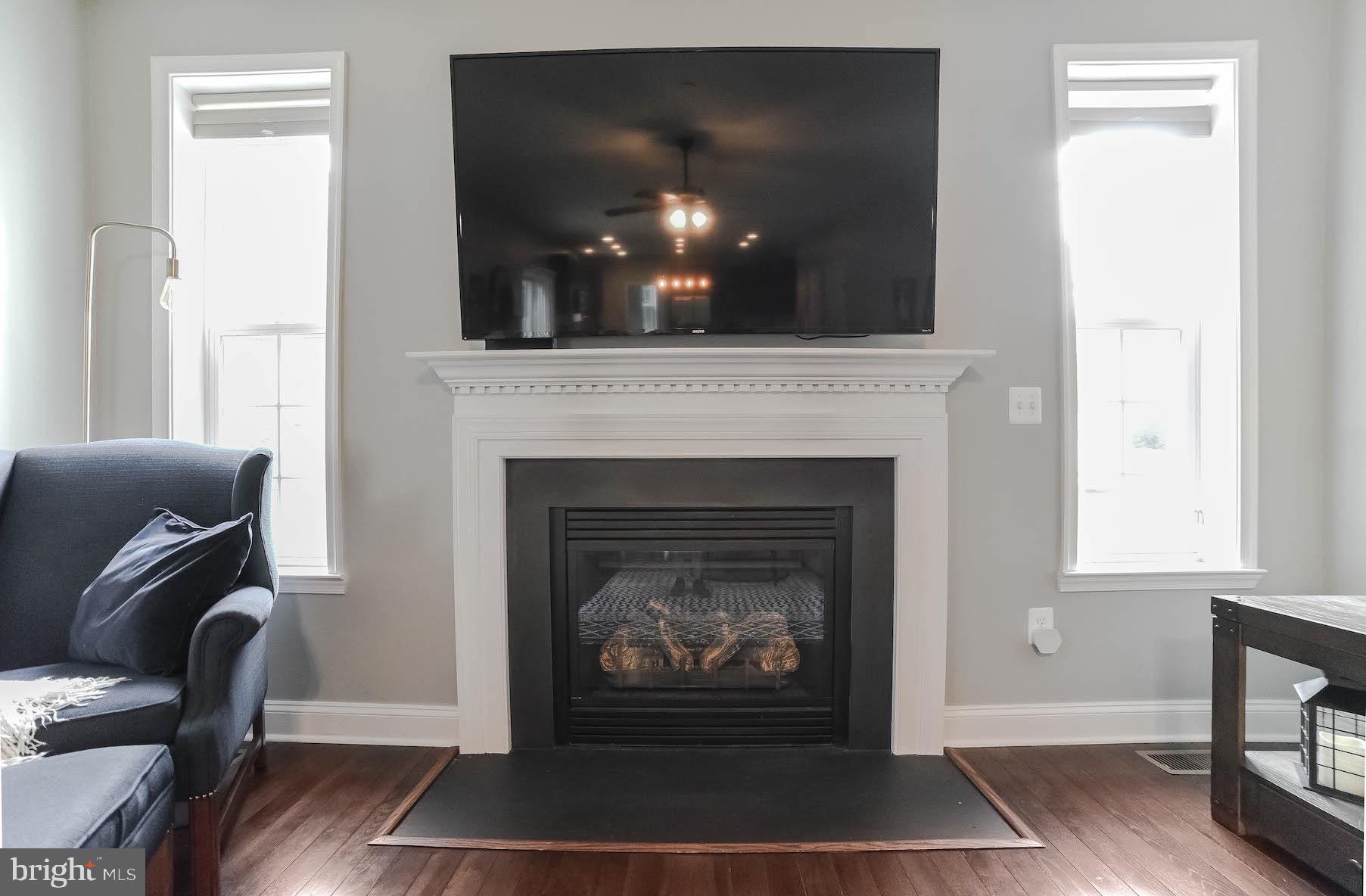 2160 Lowery Road Huntingtown, MD 20639 - Photo 19 of 53 a living room with furniture and a fireplace