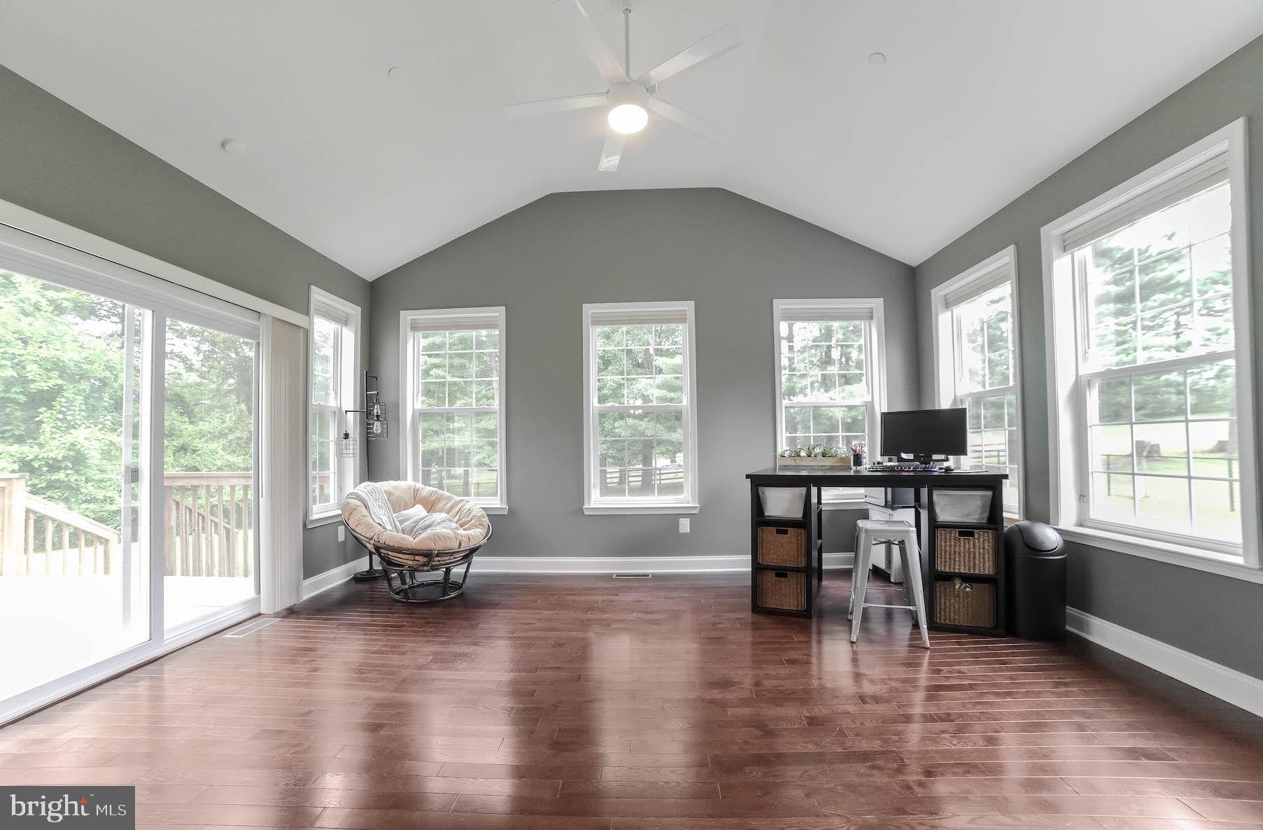 2160 Lowery Road Huntingtown, MD 20639 - Photo 23 of 53 a living room with furniture and large windows