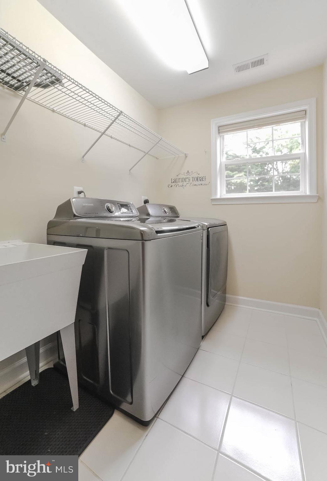 2160 Lowery Road Huntingtown, MD 20639 - Photo 24 of 53 a view of a refrigerator in kitchen and wooden floor