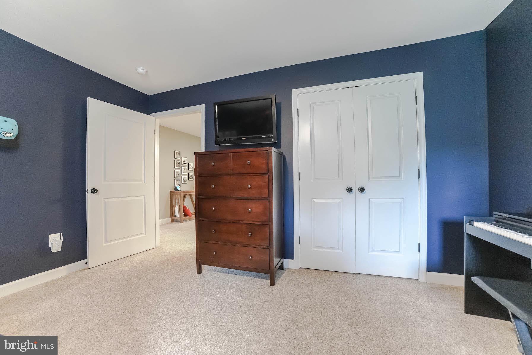 2160 Lowery Road Huntingtown, MD 20639 - Photo 26 of 53 a room with furniture and a flat screen tv