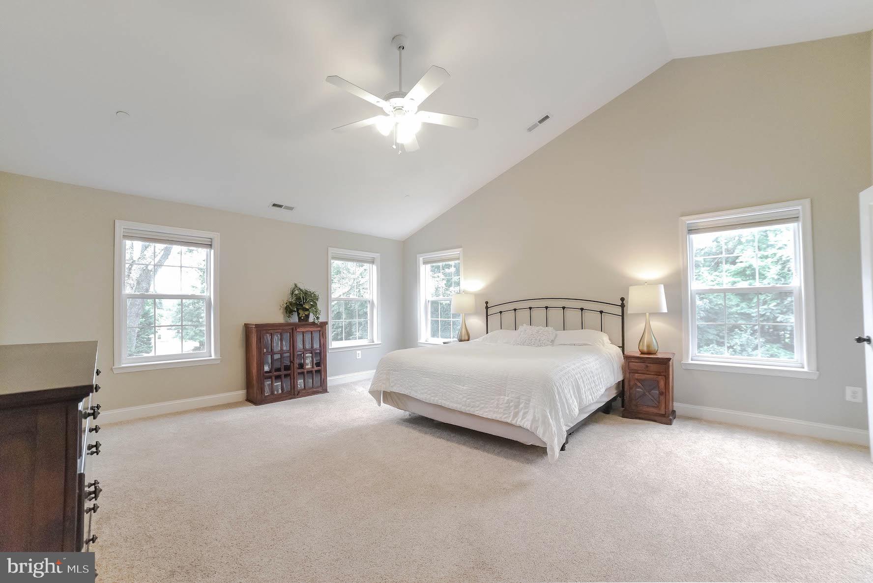 2160 Lowery Road Huntingtown, MD 20639 - Photo 31 of 53 a spacious bedroom with a bed and a large window