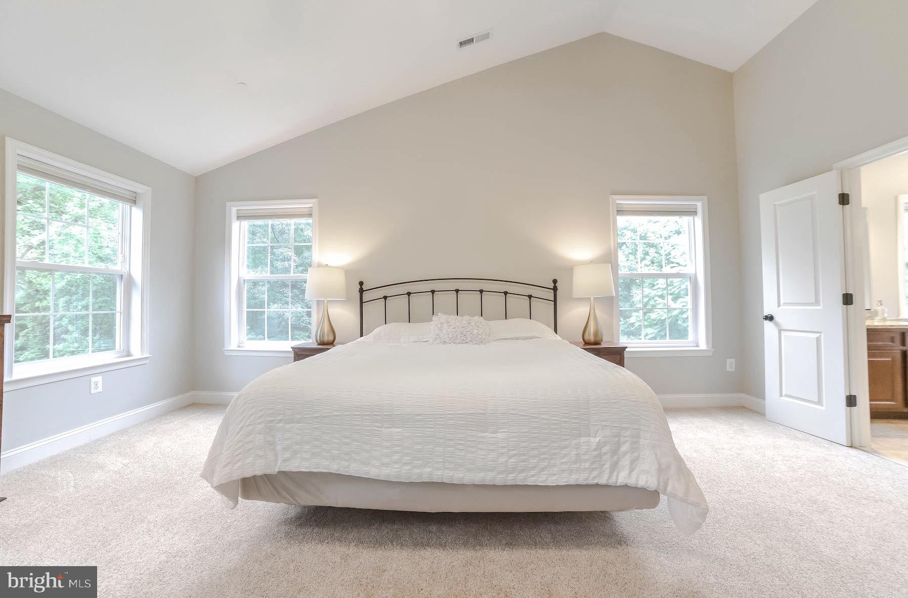 2160 Lowery Road Huntingtown, MD 20639 - Photo 32 of 53 a spacious bedroom with a bed and window