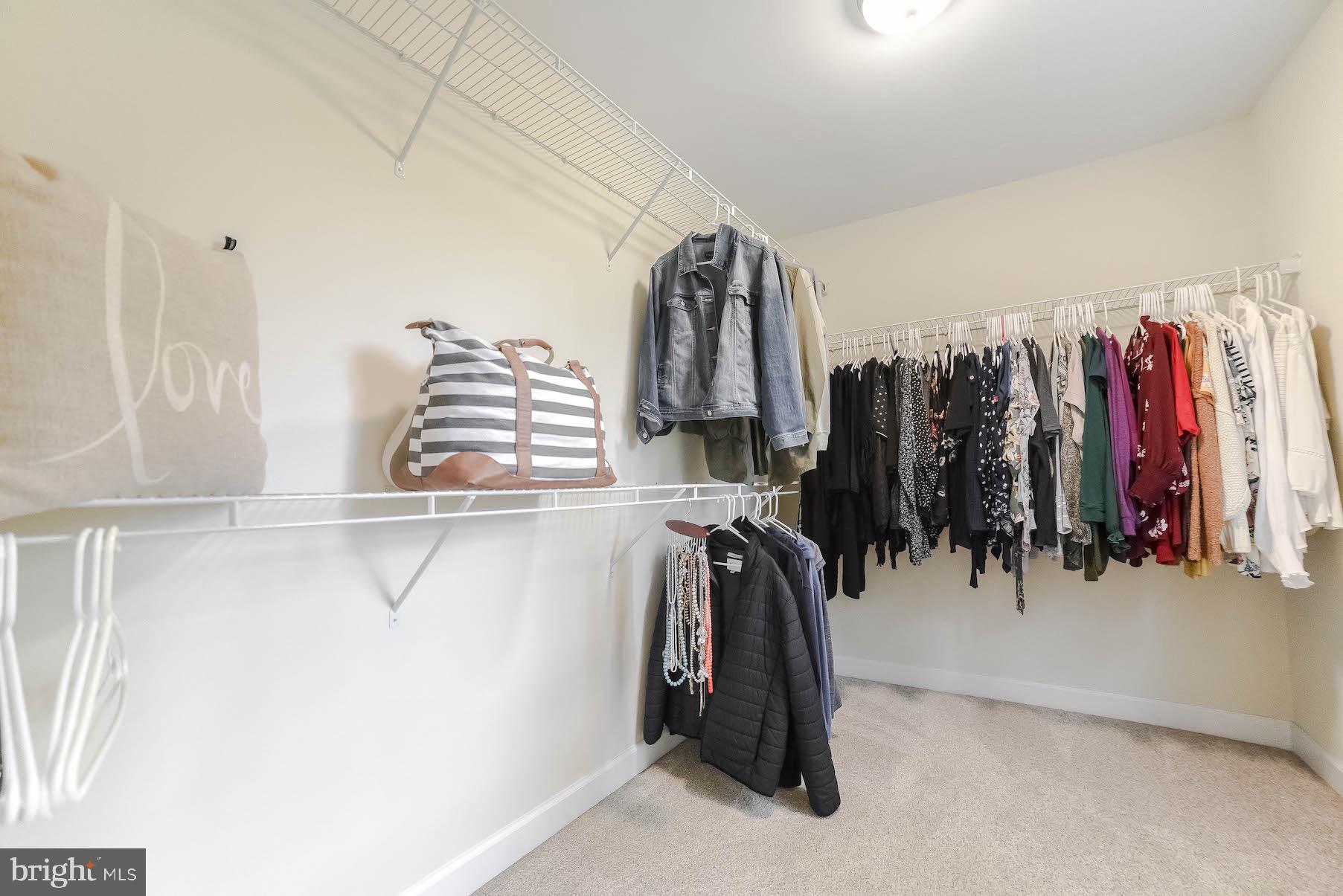 2160 Lowery Road Huntingtown, MD 20639 - Photo 34 of 53 a view of walk in closet with clothes and shoes