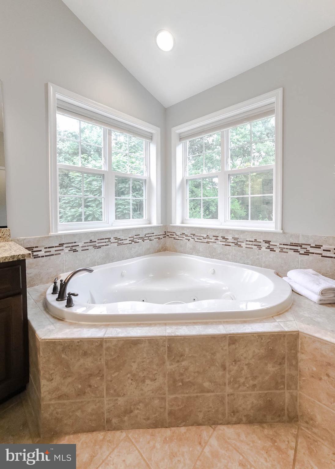 2160 Lowery Road Huntingtown, MD 20639 - Photo 36 of 53 a bath tub sitting in a bathroom next to a window