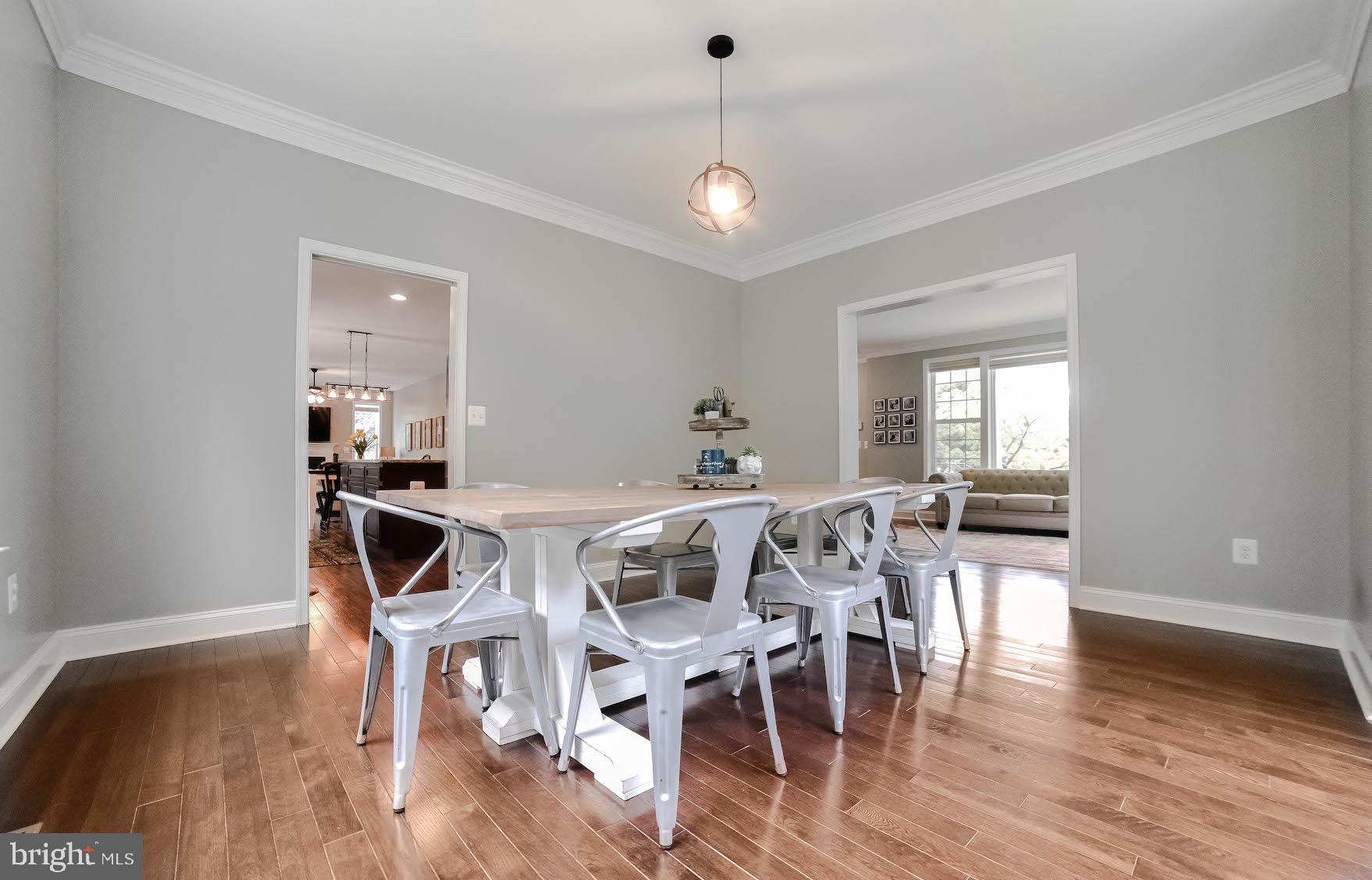 2160 Lowery Road Huntingtown, MD 20639 - Photo 5 of 53 a view of a dining room with furniture window and wooden floor