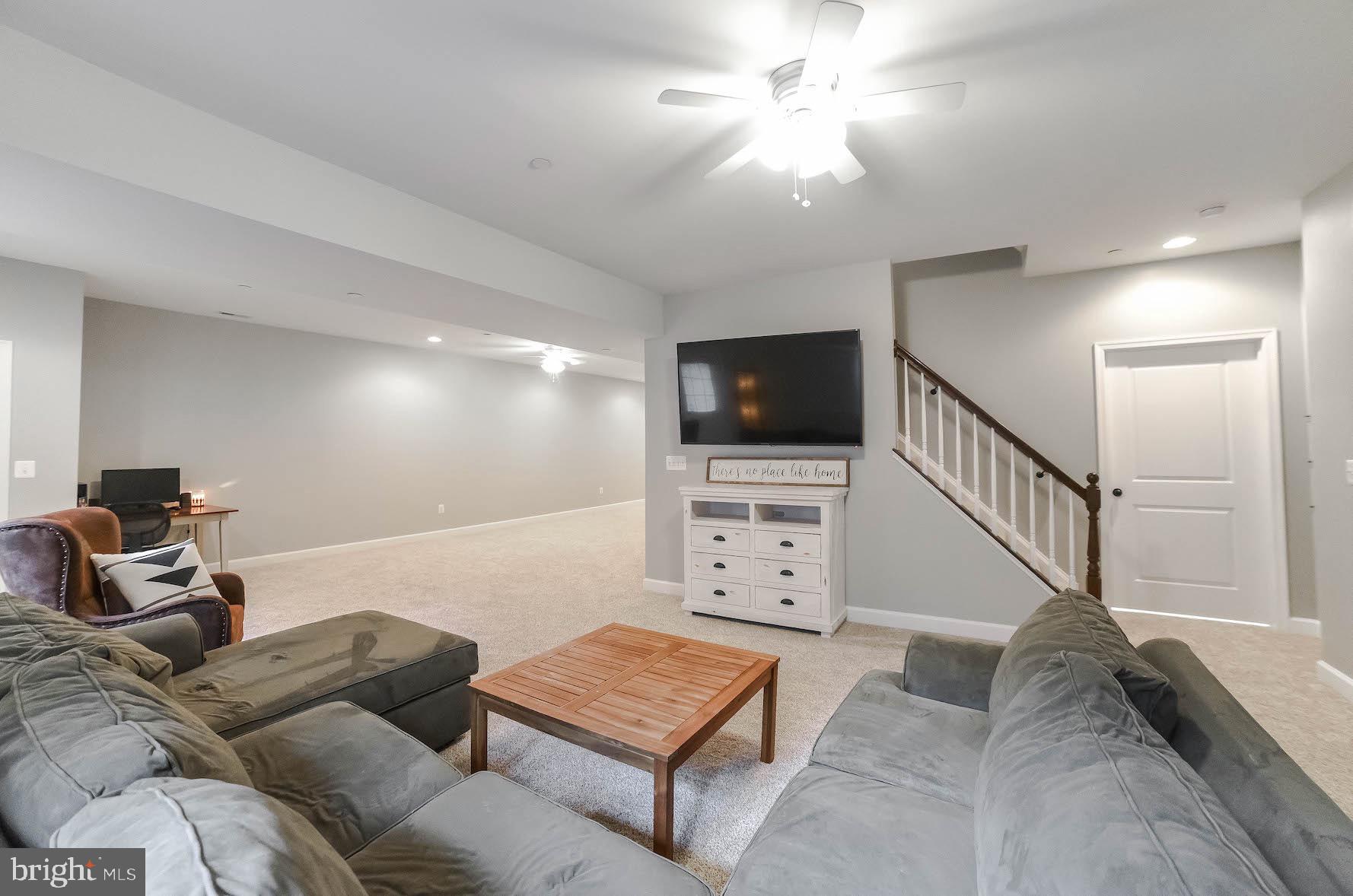 2160 Lowery Road Huntingtown, MD 20639 - Photo 41 of 53 a living room with furniture and a flat screen tv
